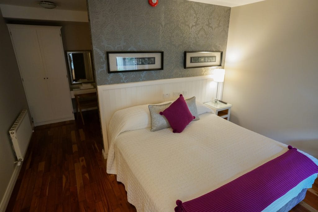 Double room with plum furnishings
